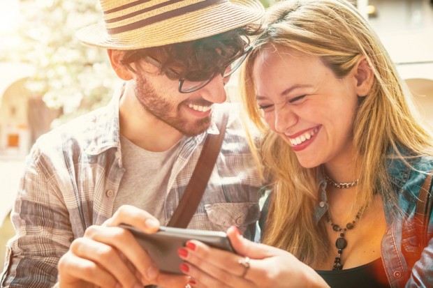 Happy Couple Having Fun with a Smartphone